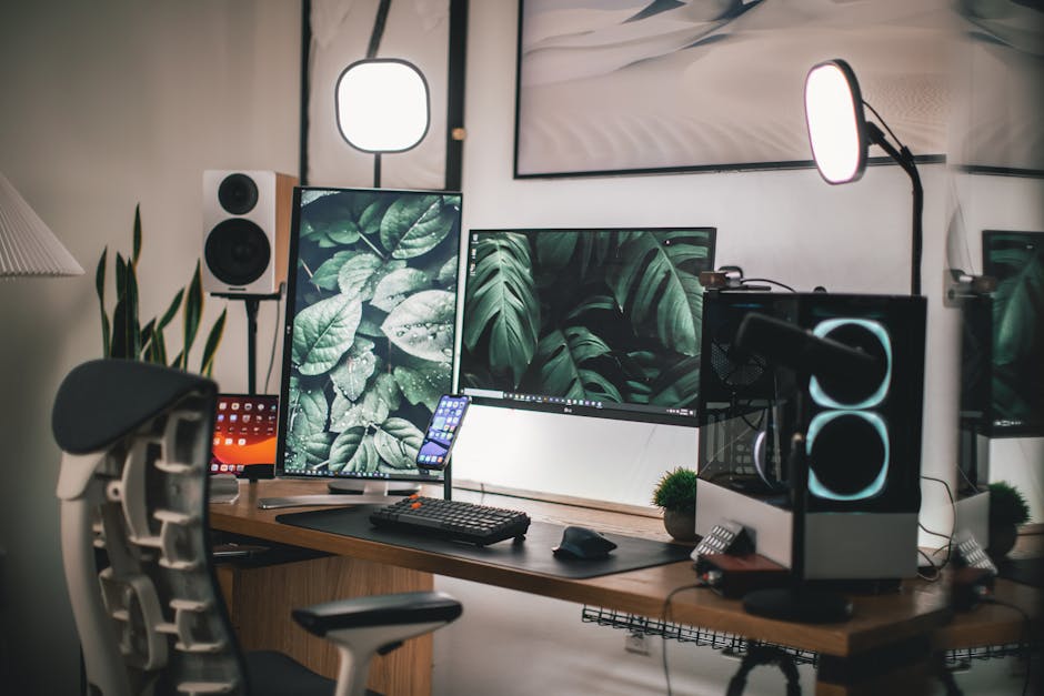 Stylish gaming and streaming setup with dual monitors, PC, and accessories.
