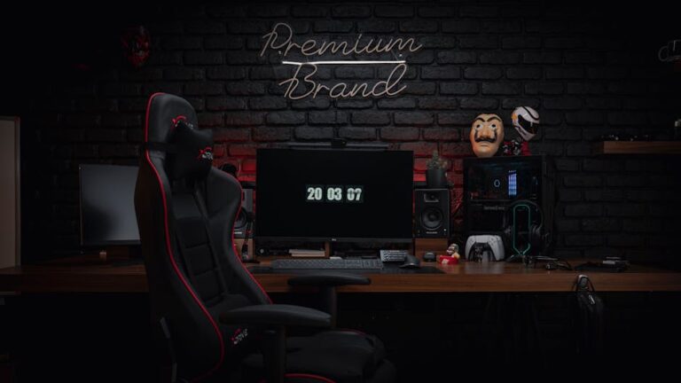 A sleek and contemporary gaming setup featuring a gaming chair, monitors, and modern tech against a black brick wall.