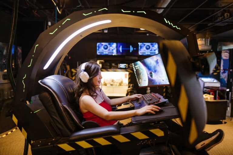 A woman plays a video game in a high-tech scorpion gaming chair, immersed in a modern arcade.