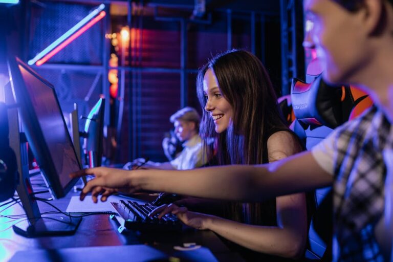 group of teenagers happily engaged in gaming at a computer s