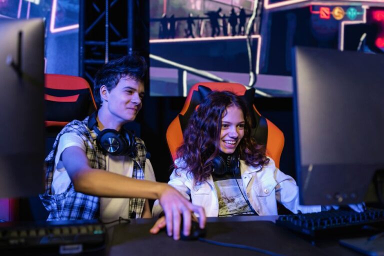 teenagers playing a multiplayer video game indoors enjoying